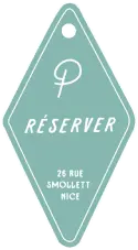 Pictogramme vert en forme de porte-clés rétro avec l'inscription Réserver et l'adresse du Pamela's Bar au 26 rue Smollett à Nice.
